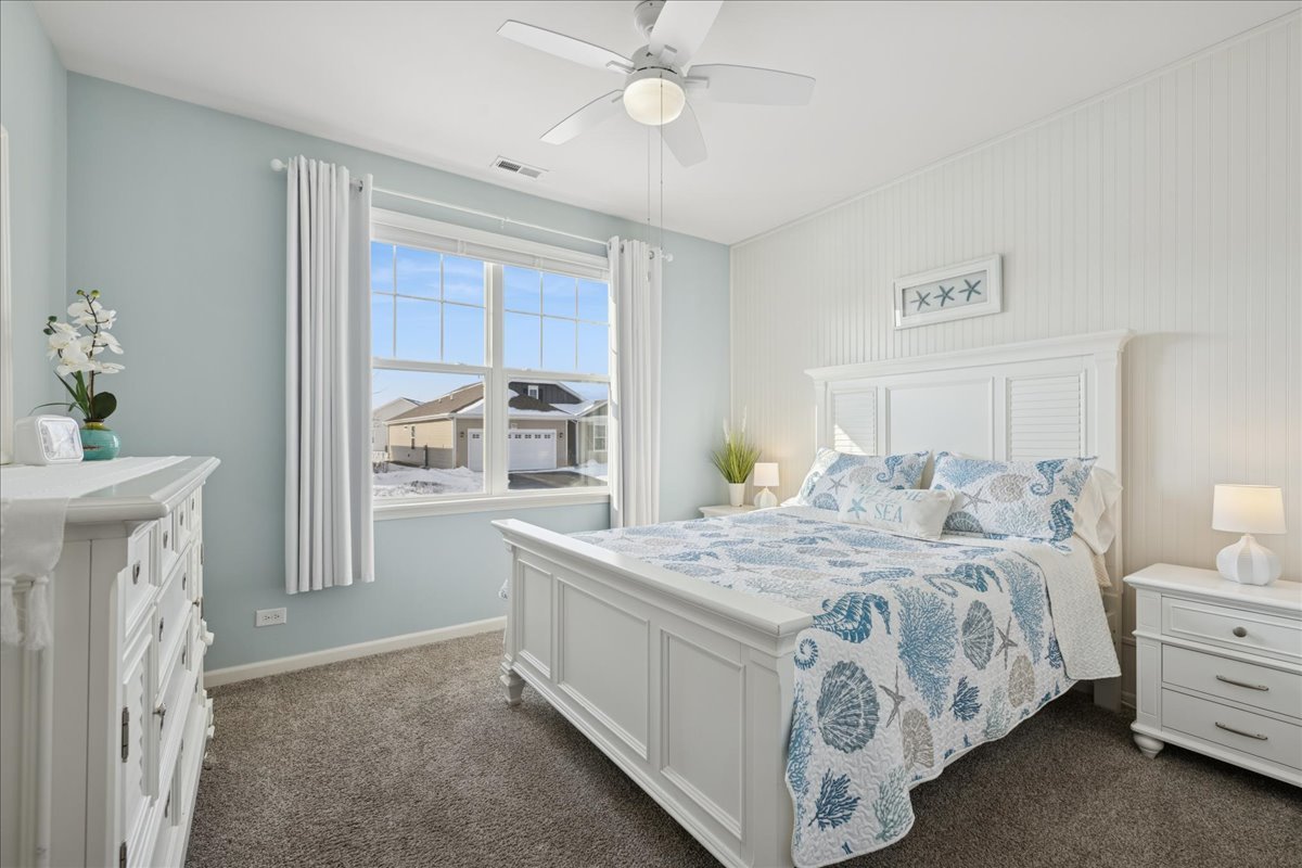 1639 Rochester Road Pingree Grove, IL 60140 - Photo 14 of 21 a bedroom with a bed and a chandelier