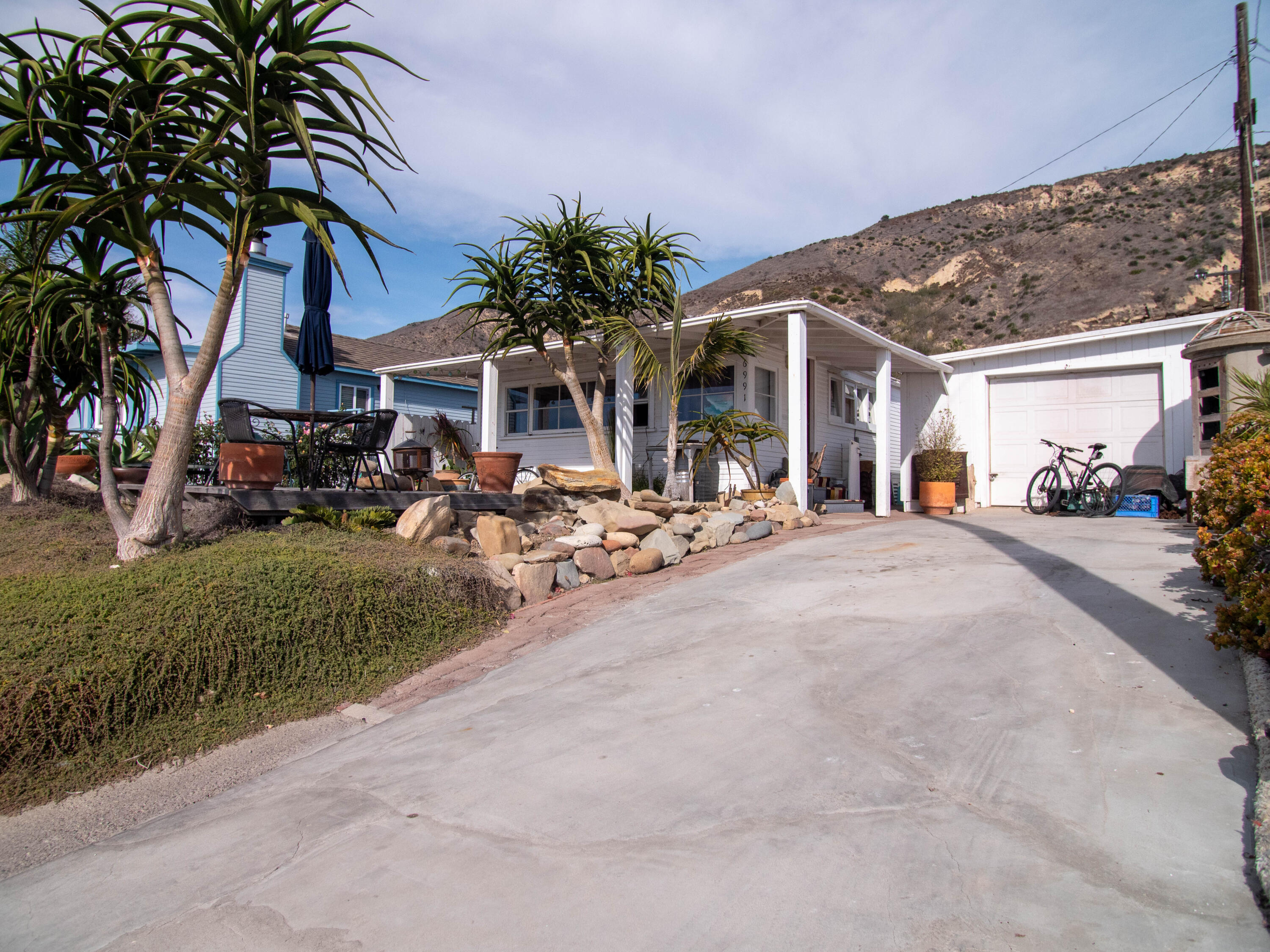 6991 West Surfside Street Ventura, CA 93001 - Photo 2 of 5 a view of a building with a street