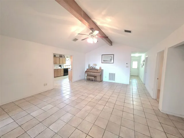 a view of a livingroom with furniture and an entryway