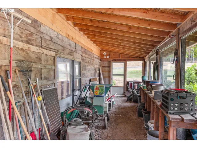 a view of a patio with table and chairs potted plants with wooden floor