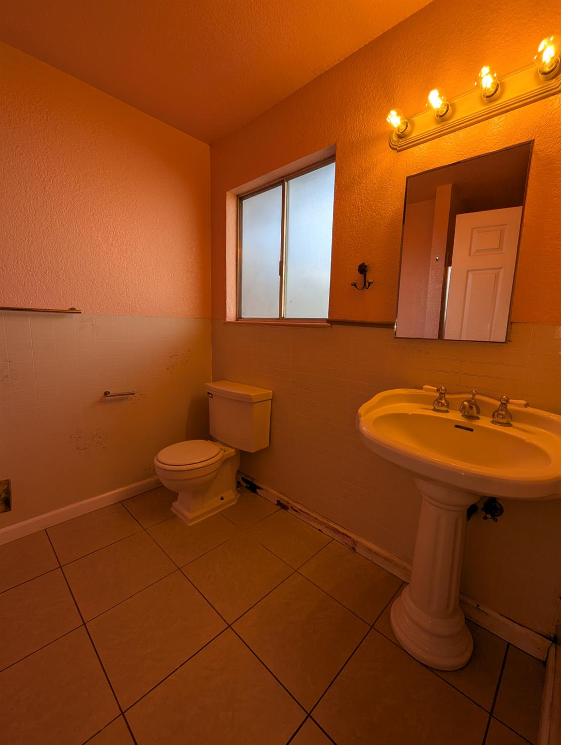 2228 Drake Avenue Merced, CA 95348 - Photo 15 of 24 a bathroom with a sink a toilet and mirror