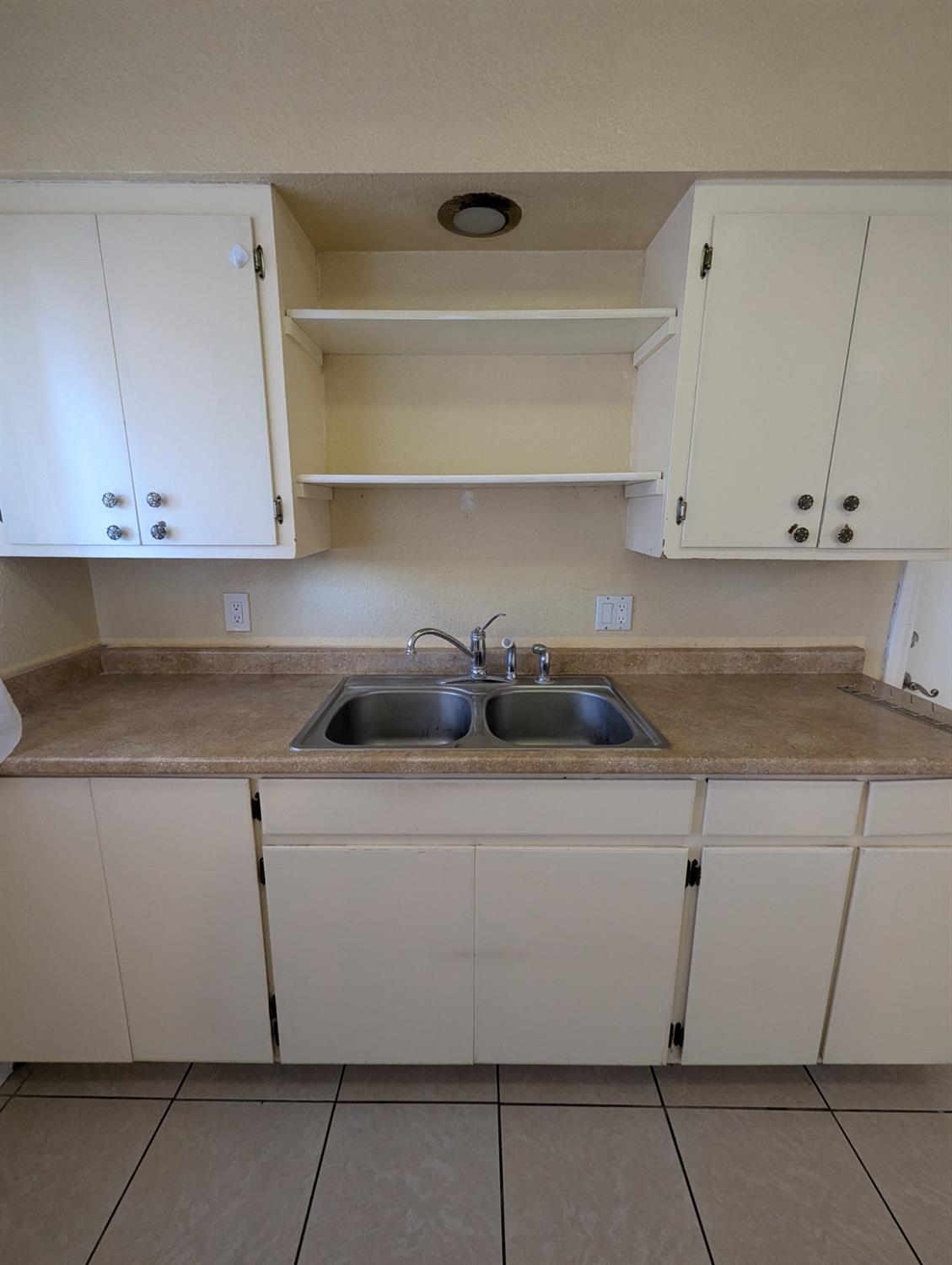 2228 Drake Avenue Merced, CA 95348 - Photo 8 of 24 a kitchen with a cabinets and a stove