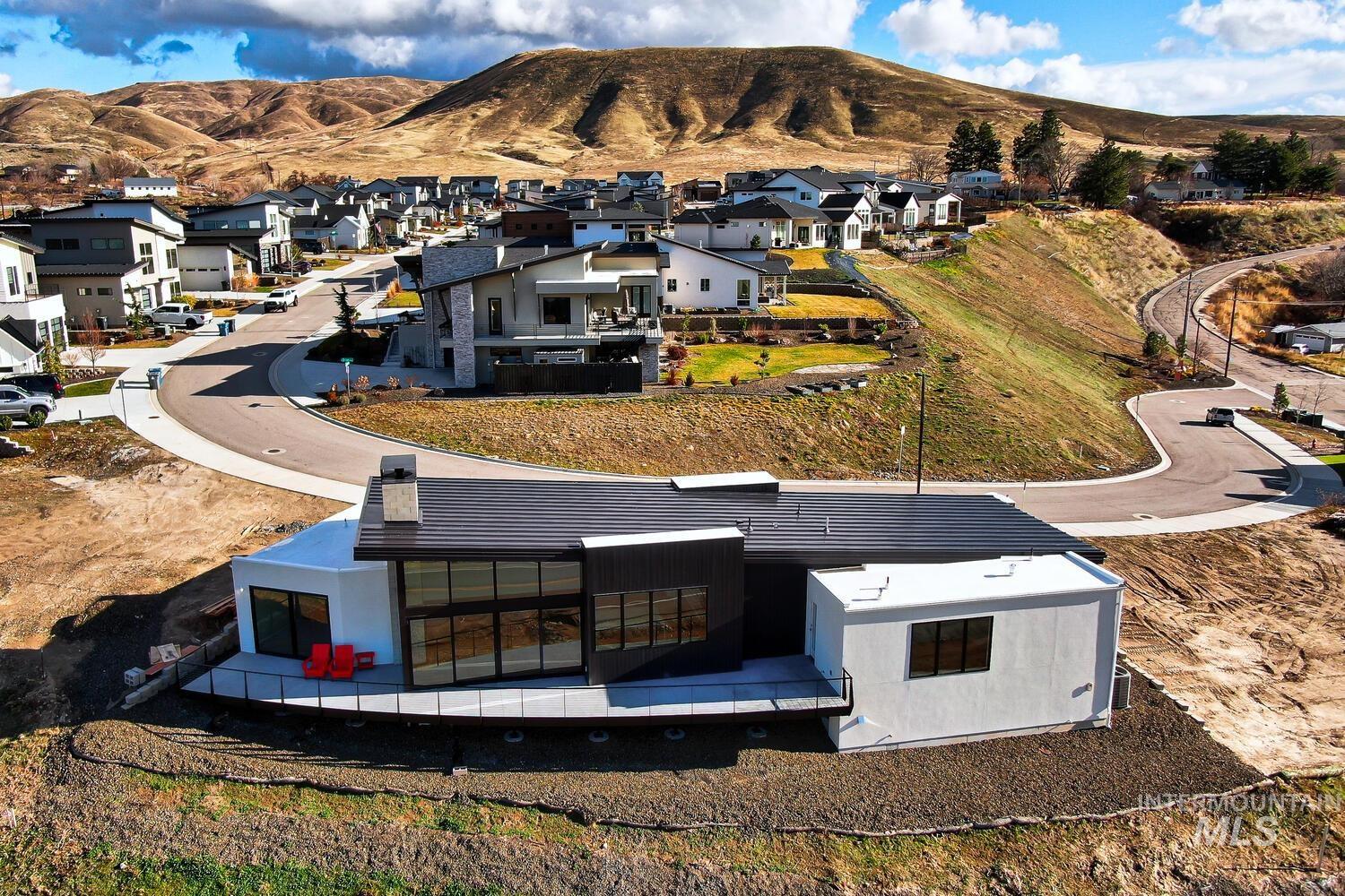 5775 South Brian Way Boise, ID 83716 - Photo 10 of 13 Aerial perspective of suburban area with a mountain backdrop