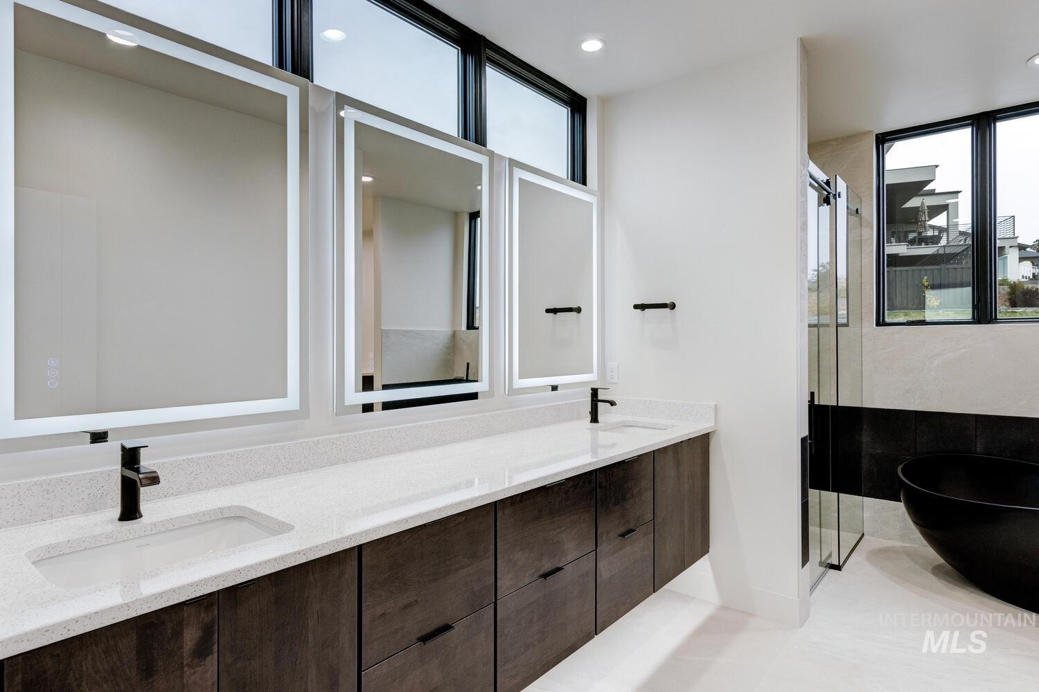 5775 South Brian Way Boise, ID 83716 - Photo 6 of 13 Full bathroom with double vanity, a shower stall, a soaking tub, light tile patterned floors, and recessed lighting