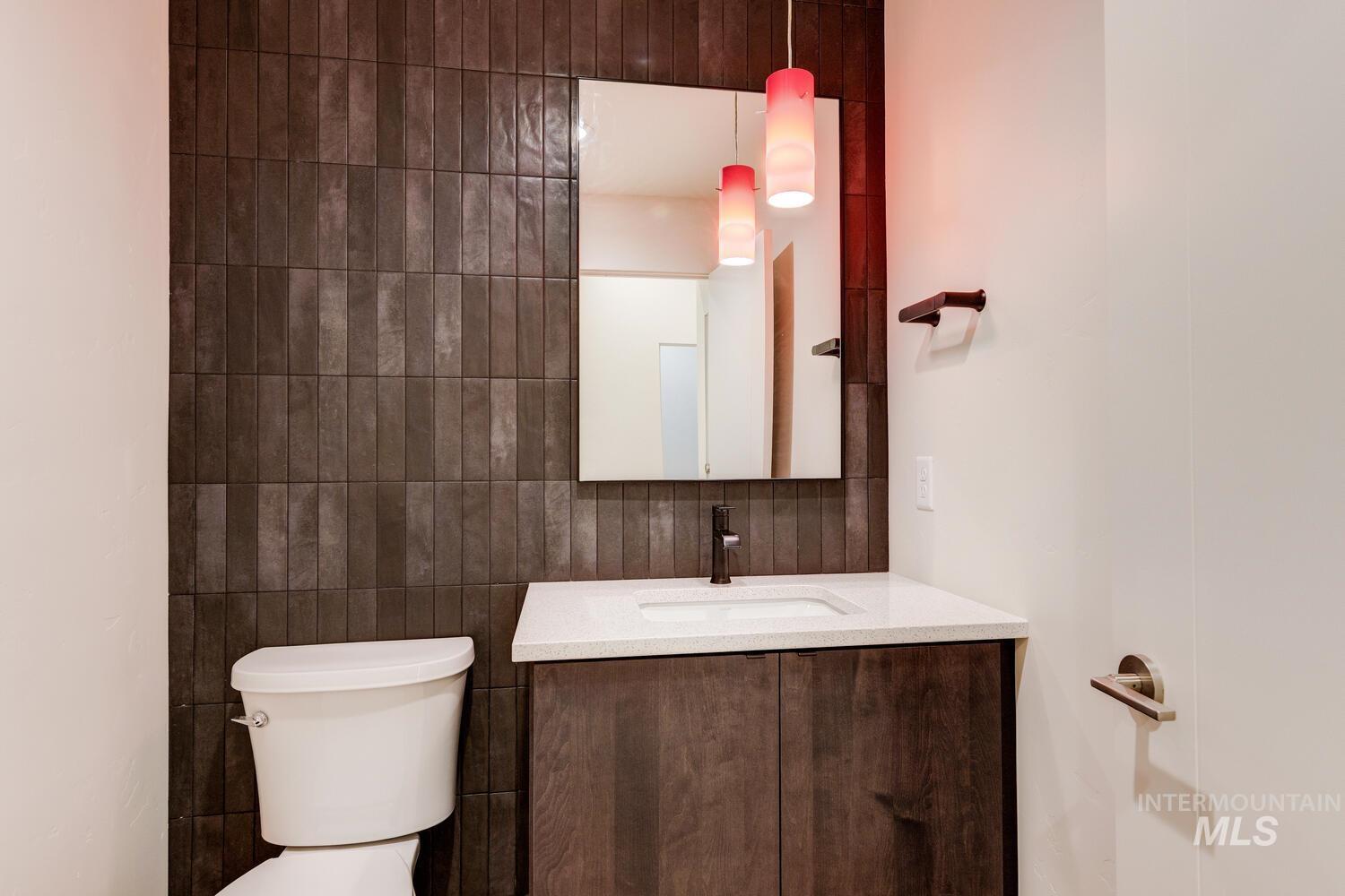5775 South Brian Way Boise, ID 83716 - Photo 9 of 13 Half bath with tile walls and vanity