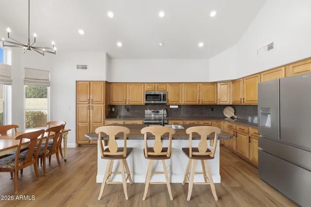 a view of a white house with a swimming pool