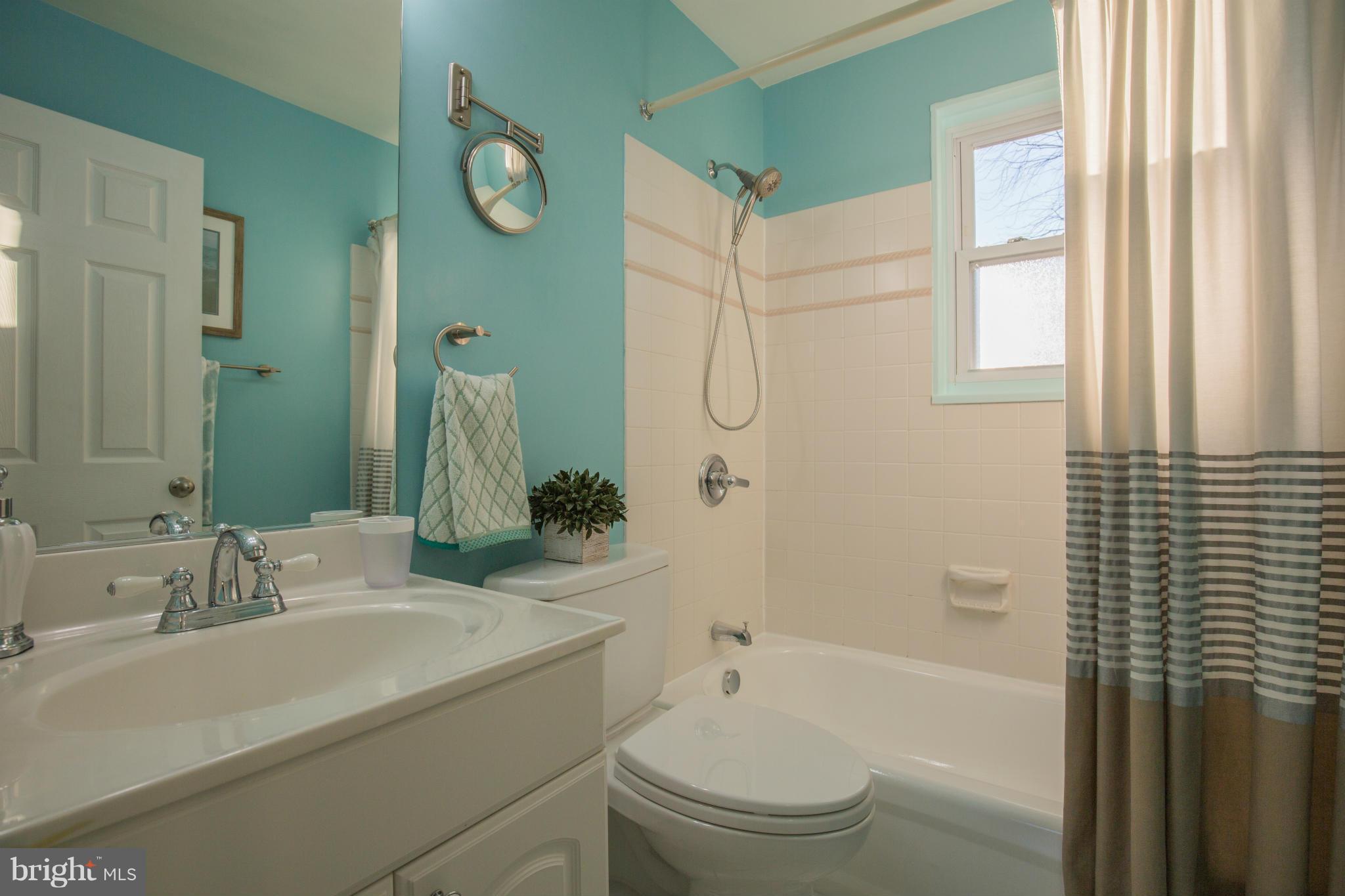 12716 Feldon Street Silver Spring, MD 20906 - Photo 15 of 30 a bathroom with a sink toilet and shower