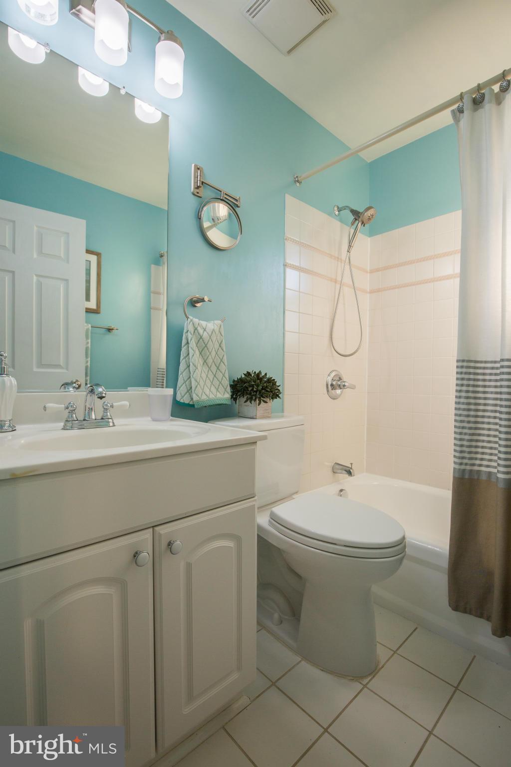 12716 Feldon Street Silver Spring, MD 20906 - Photo 16 of 30 a bathroom with a double vanity sink mirror and toilet