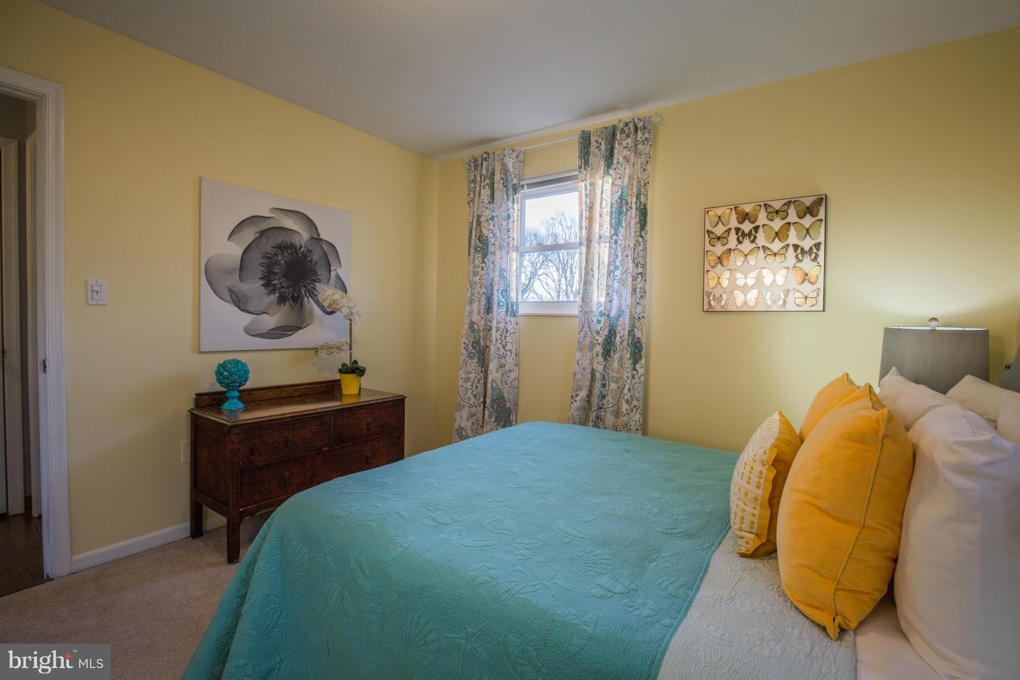 12716 Feldon Street Silver Spring, MD 20906 - Photo 18 of 30 a bedroom with a bed and window