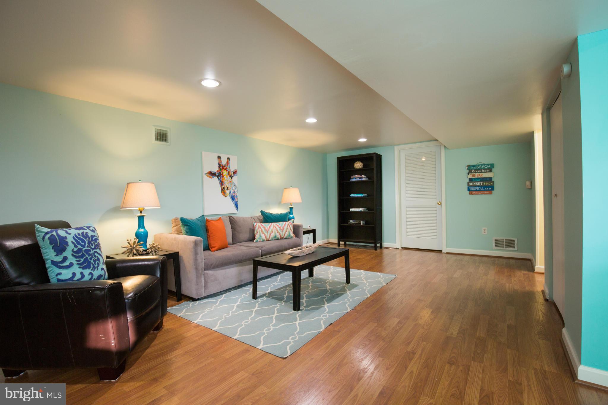 12716 Feldon Street Silver Spring, MD 20906 - Photo 21 of 30 a living room with furniture and a wooden floor