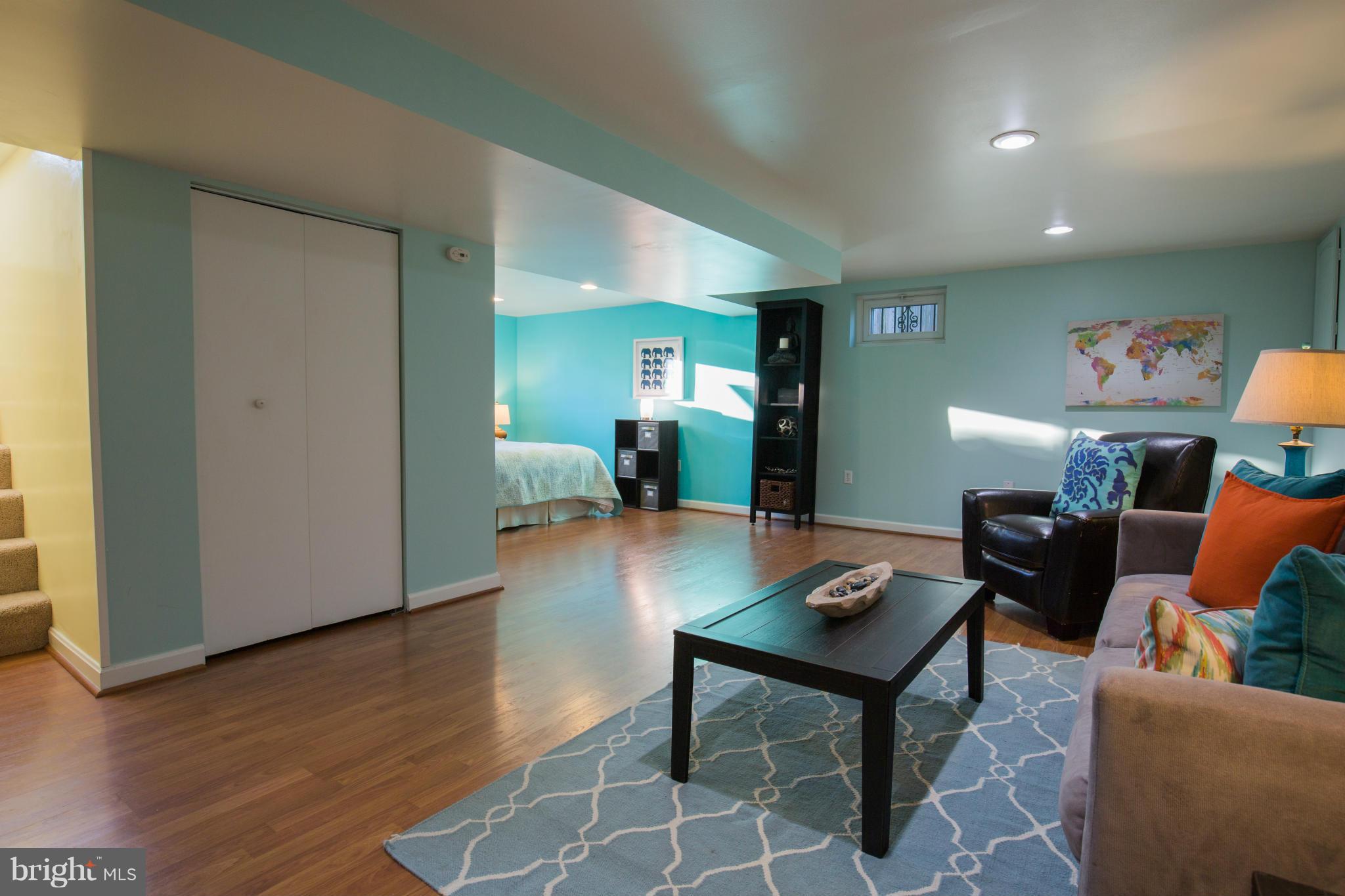 12716 Feldon Street Silver Spring, MD 20906 - Photo 22 of 30 a living room with furniture and a wooden floor