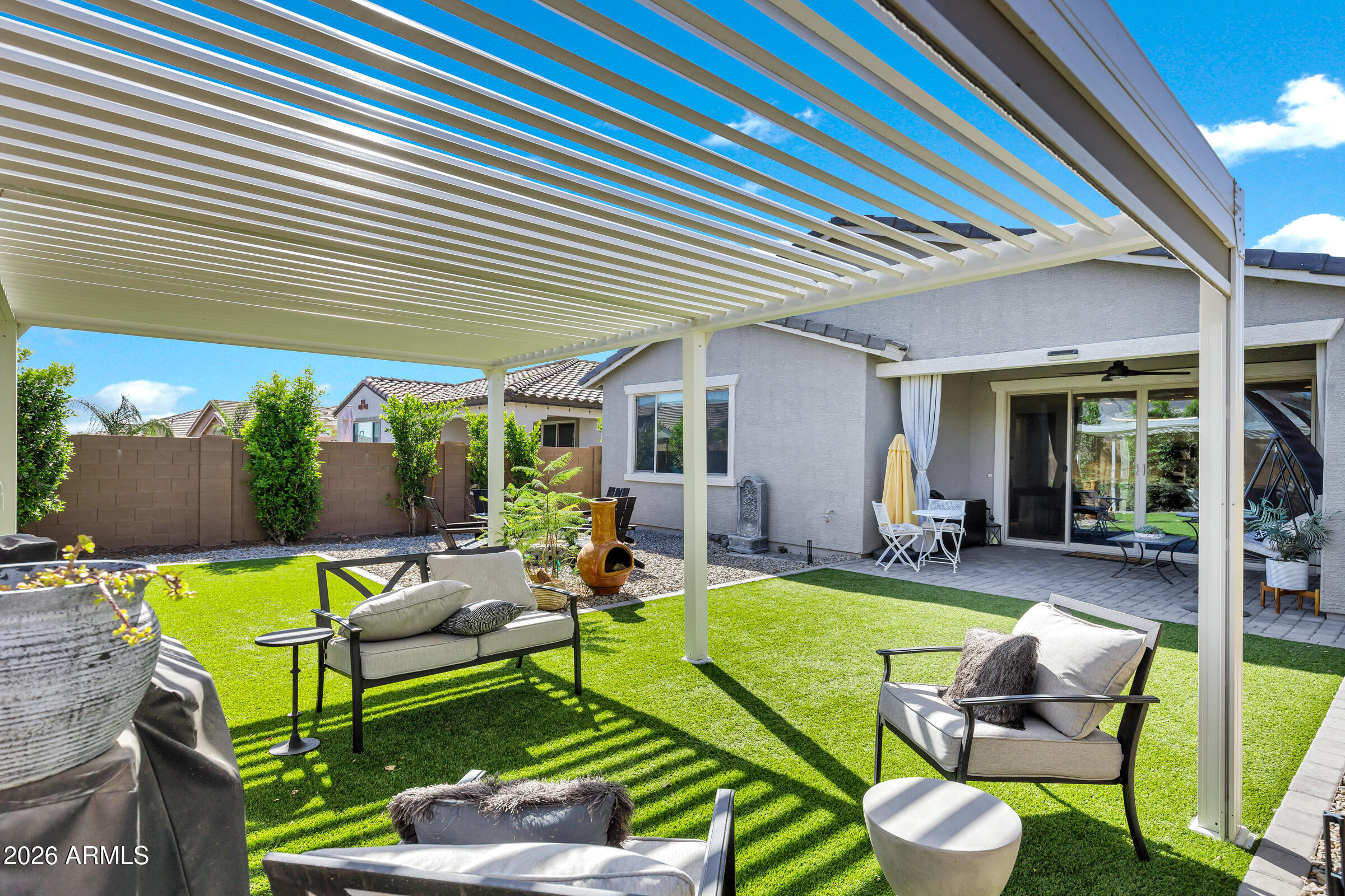12243 East Sereno Road Gold Canyon, AZ 85118 - Photo 35 of 37 a view of a patio with couches chairs and a table and chairs