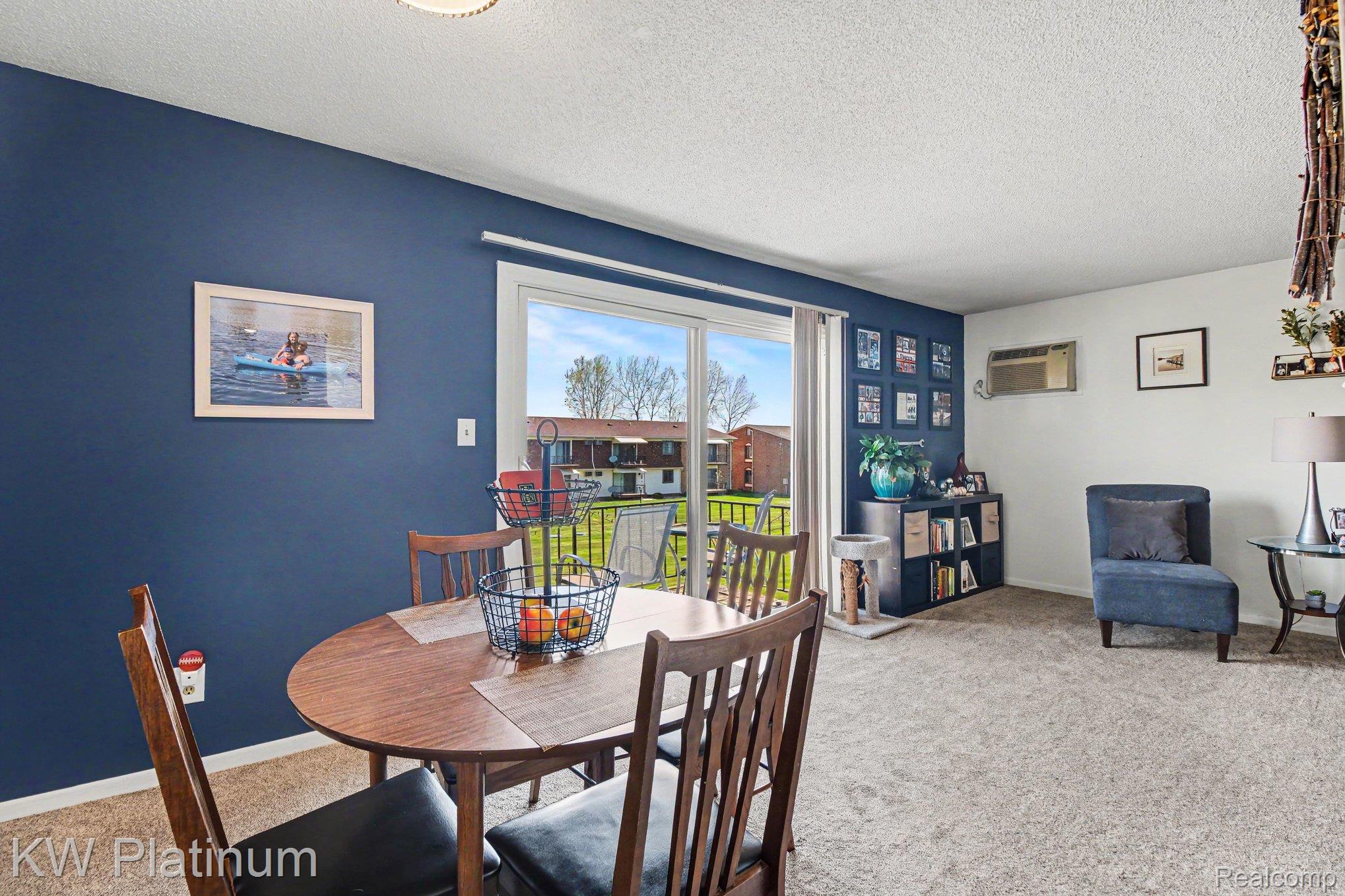 1900 River Road, Unit C5 Marysville, MI 48040 - Photo 4 of 15 Dining area featuring light carpet and a textured ceiling