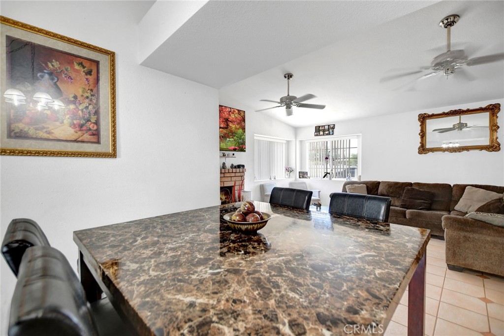 24880 Balestrieri Road Hemet, CA 92544 - Photo 13 of 34 a living room with furniture and a chandelier