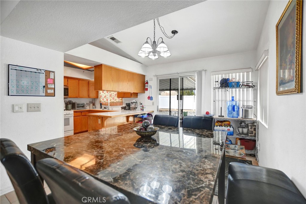 24880 Balestrieri Road Hemet, CA 92544 - Photo 14 of 34 a living room with fireplace furniture and a large window