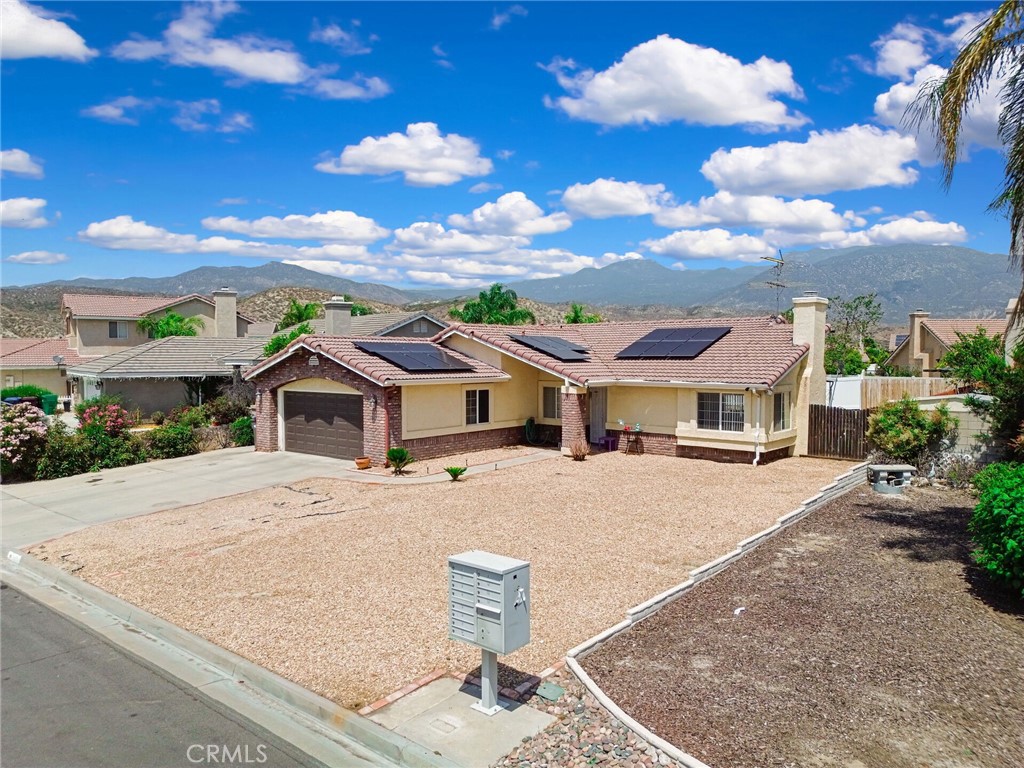 24880 Balestrieri Road Hemet, CA 92544 - Photo 28 of 34 a front view of a house with a yard