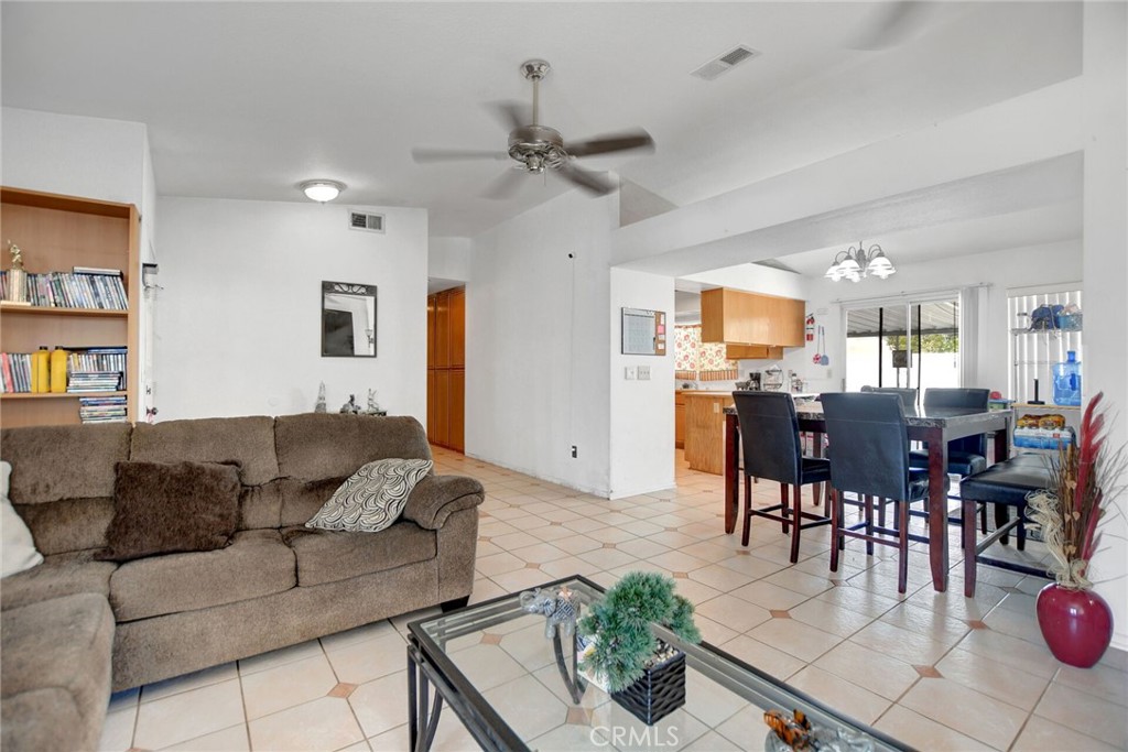 24880 Balestrieri Road Hemet, CA 92544 - Photo 7 of 34 a living room with furniture kitchen view and a dining table