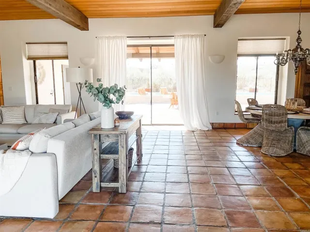 a lobby with furniture and window