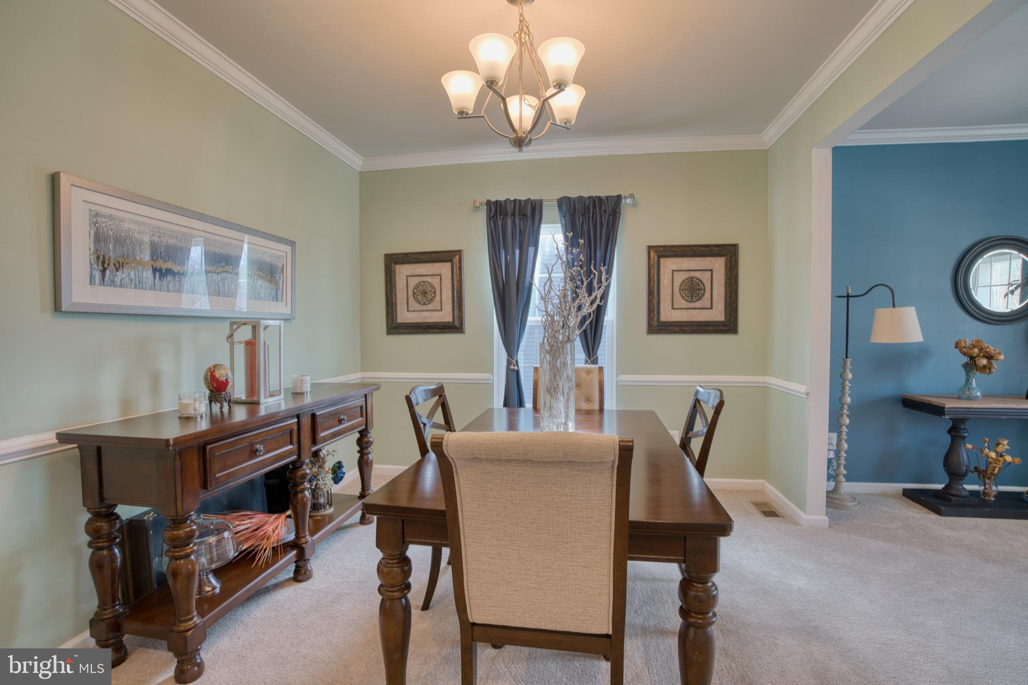 505 Potomac Road Joppa, MD 21085 - Photo 13 of 66 a view of a dining room with furniture and a chandelier
