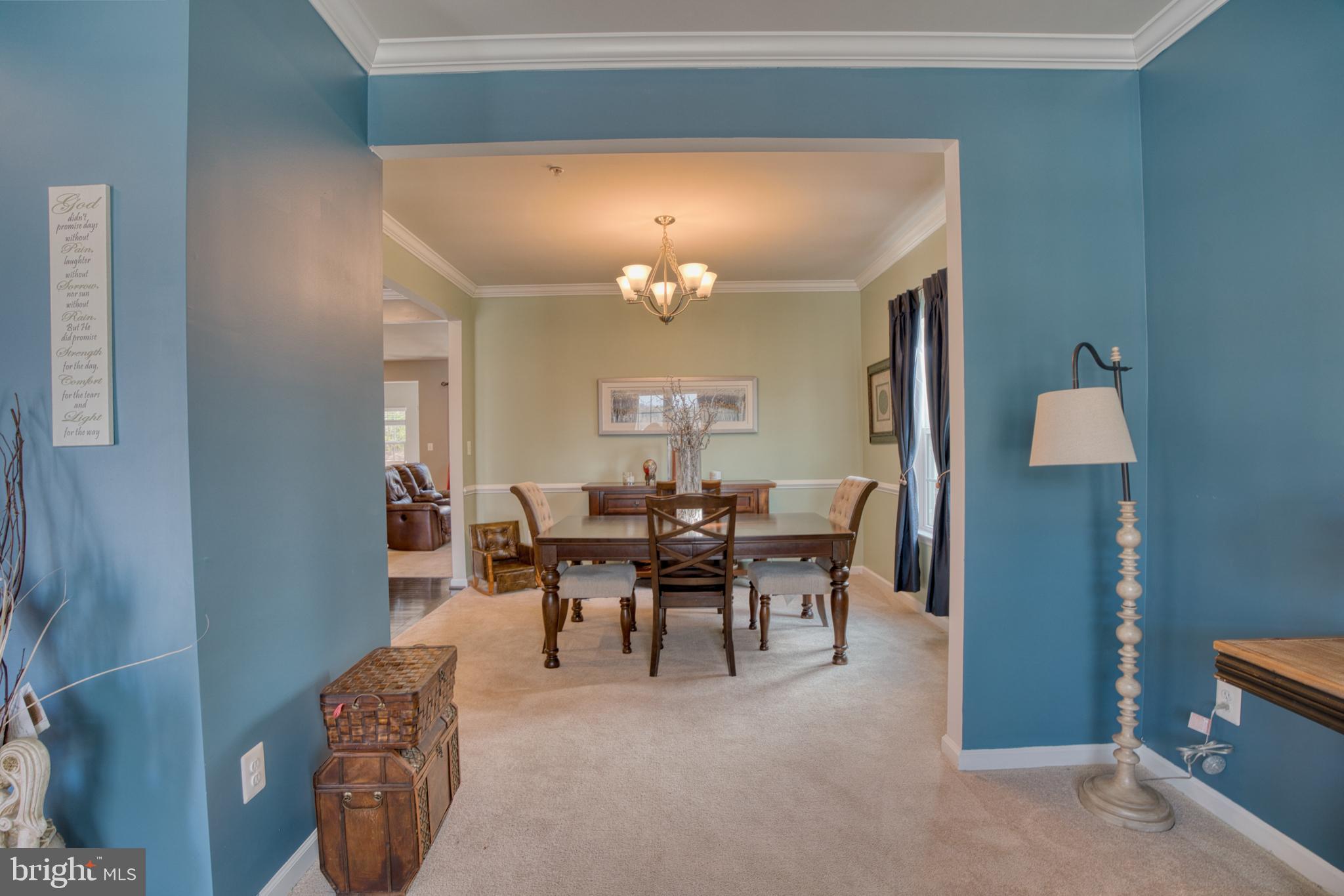 505 Potomac Road Joppa, MD 21085 - Photo 15 of 66 a dining room with furniture and a chandelier