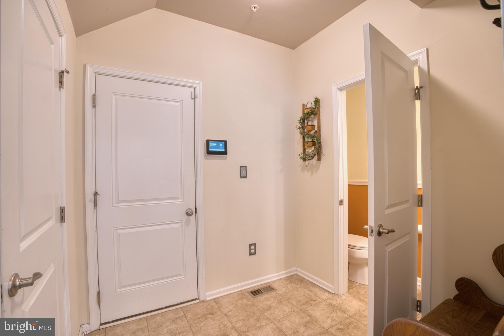505 Potomac Road Joppa, MD 21085 - Photo 28 of 66 a view of a livingroom with wooden floor and cabinet