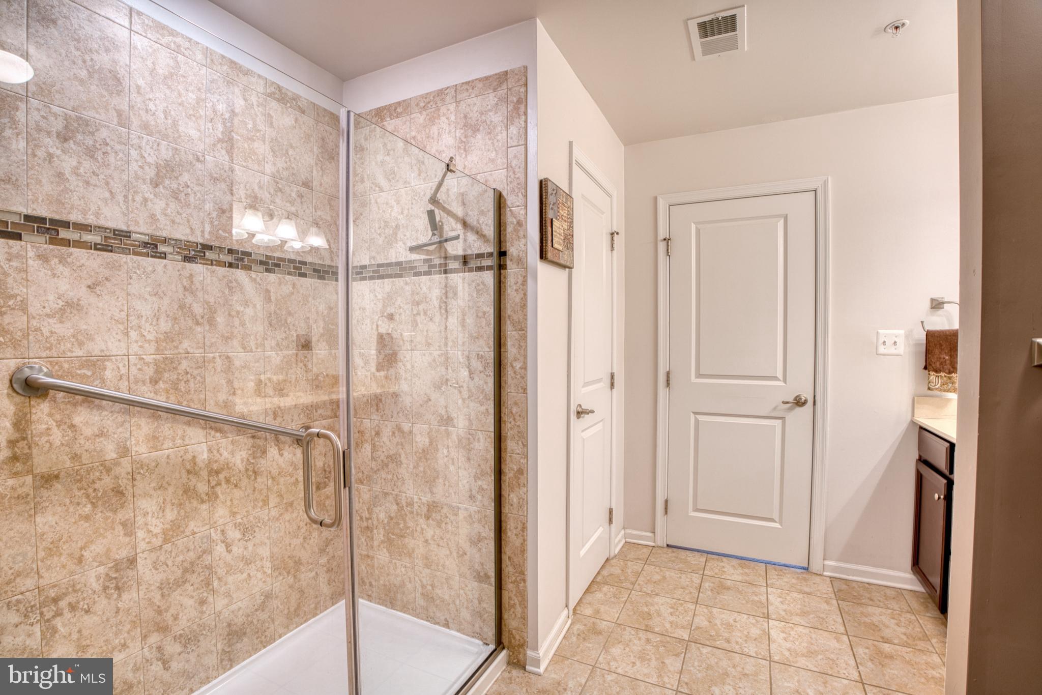 505 Potomac Road Joppa, MD 21085 - Photo 51 of 66 a bathroom with a shower and a glass door