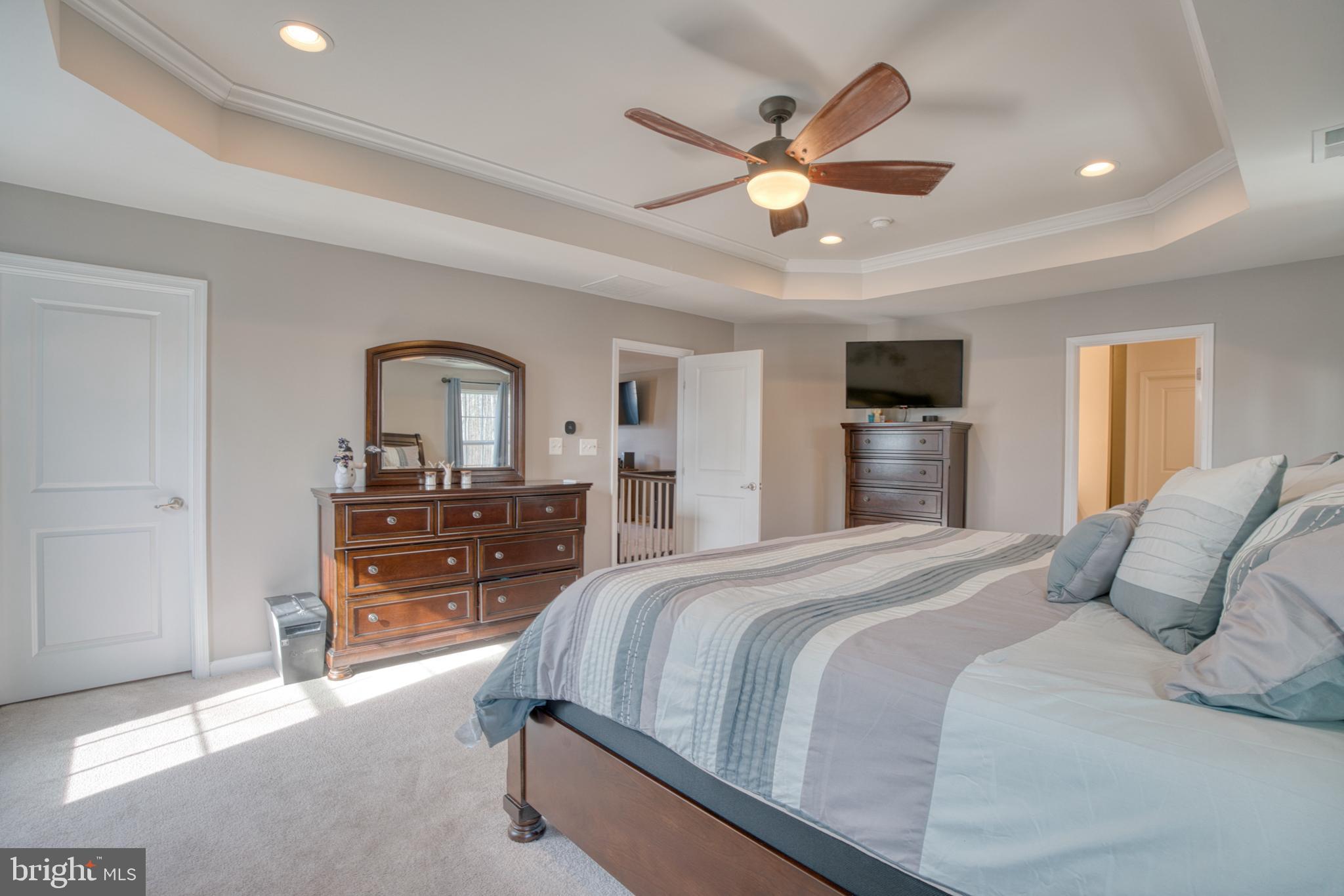 505 Potomac Road Joppa, MD 21085 - Photo 56 of 66 a bedroom with a large bed and a chandelier