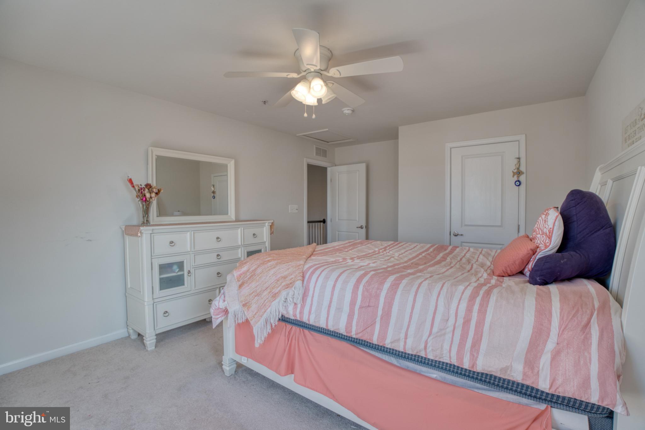 505 Potomac Road Joppa, MD 21085 - Photo 59 of 66 a bedroom with a bed and a chandelier