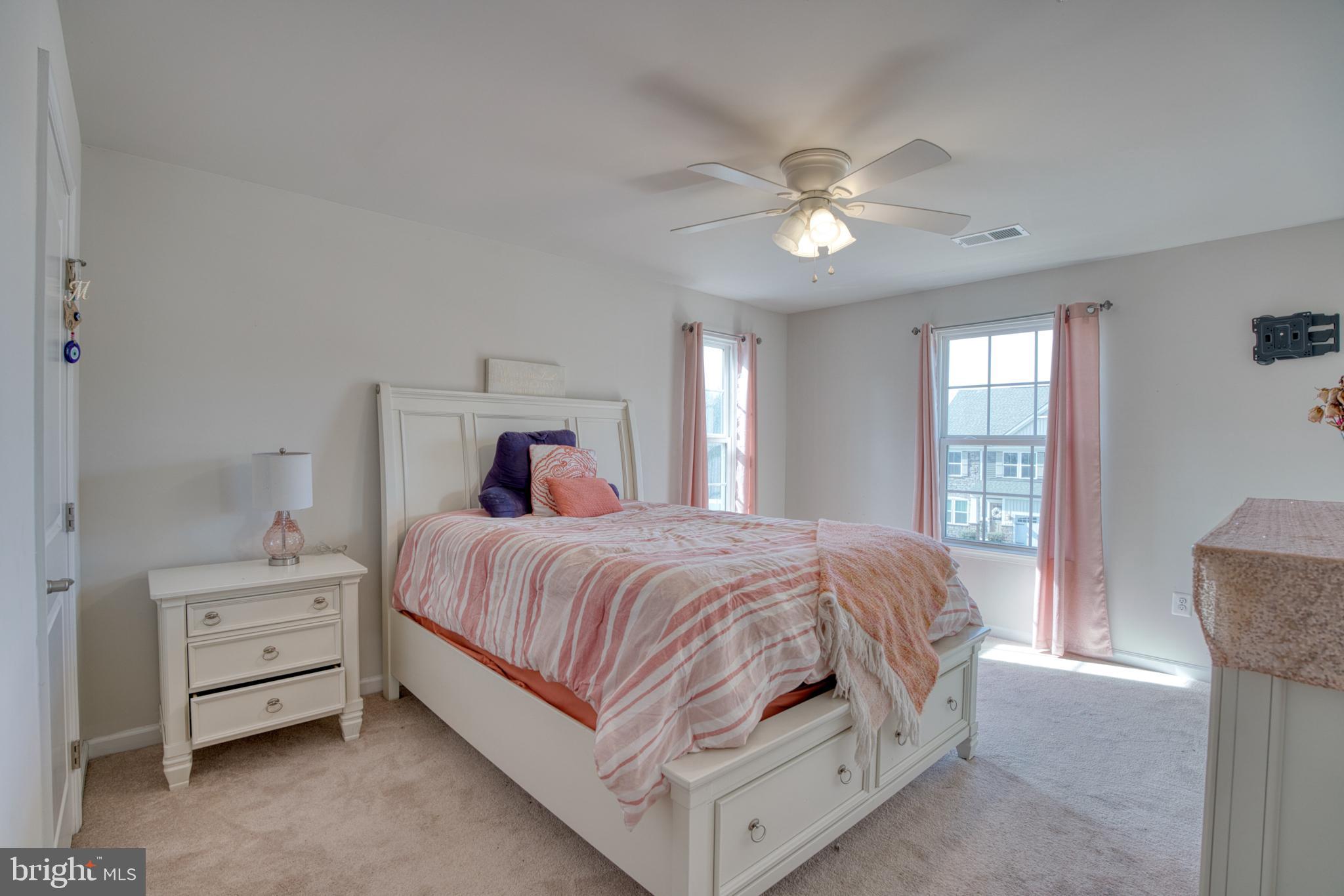 505 Potomac Road Joppa, MD 21085 - Photo 60 of 66 a bedroom with a bed and a chandelier