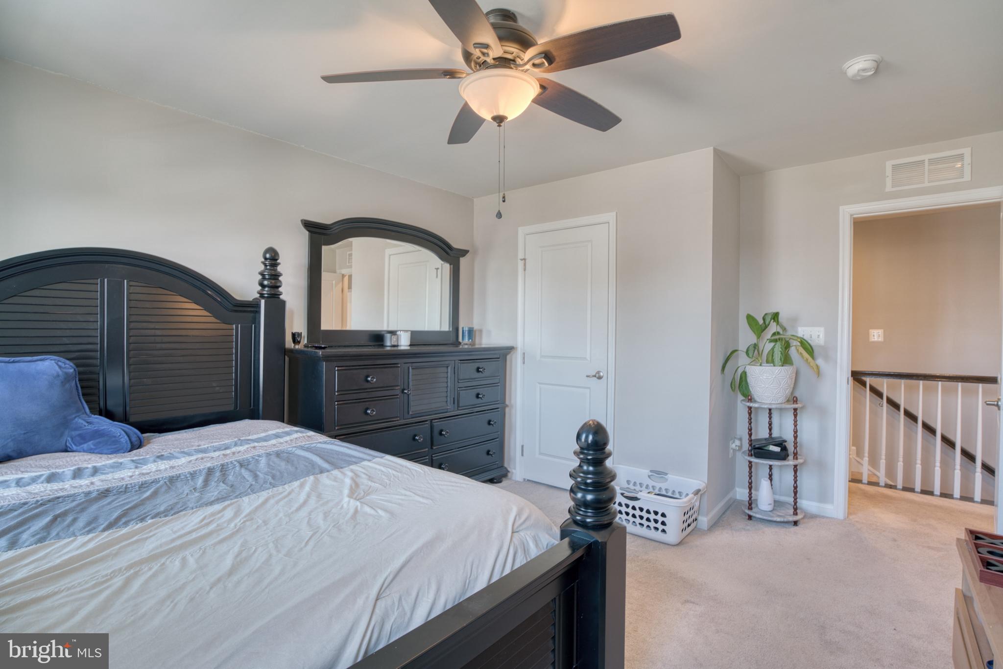 505 Potomac Road Joppa, MD 21085 - Photo 63 of 66 a bedroom with a bed and a chandelier