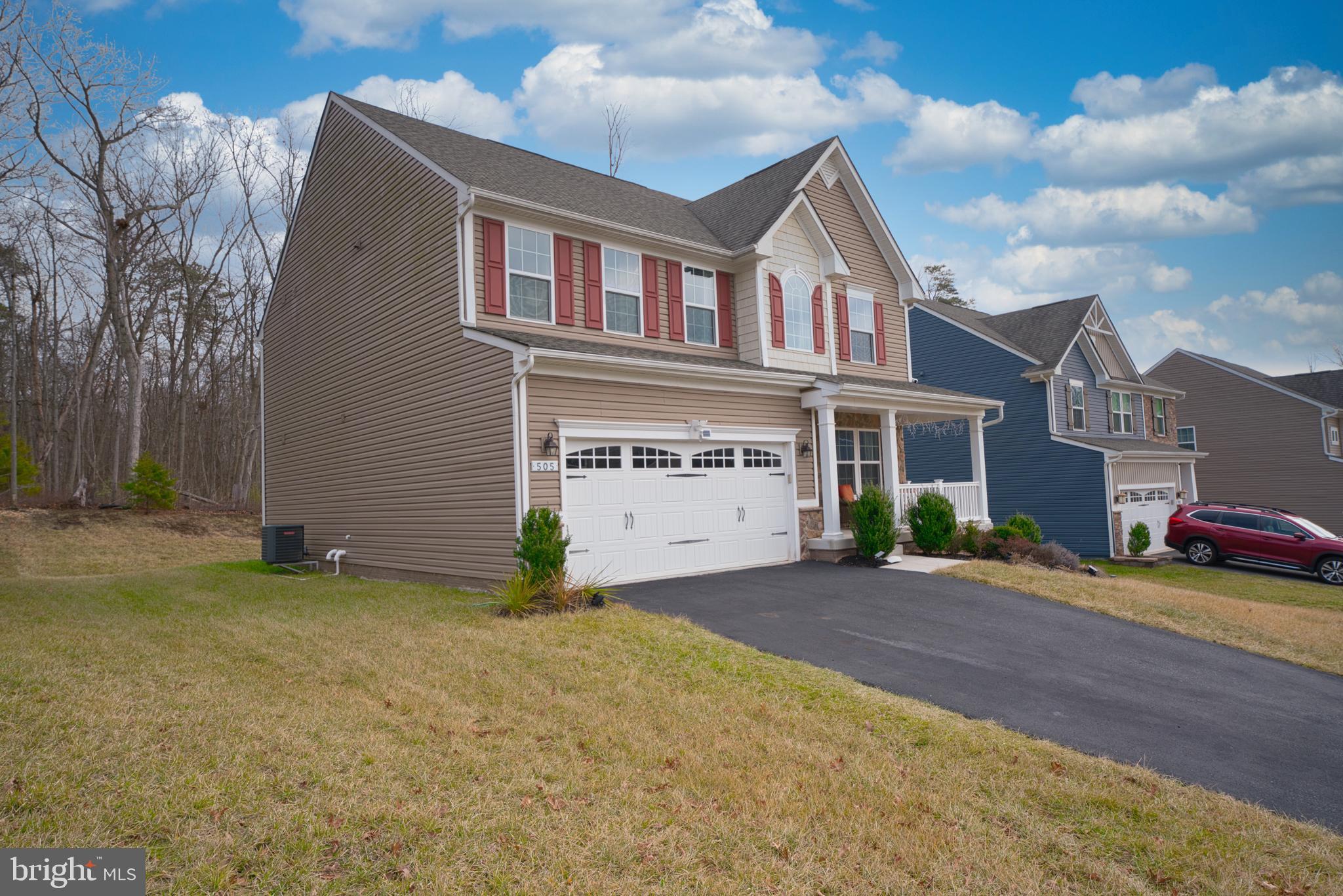 505 Potomac Road Joppa, MD 21085 - Photo 7 of 66 a front view of a house with a yard and garage