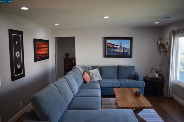 a living room with furniture and a rug