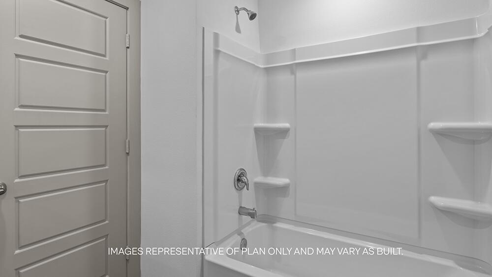 7339 9th Street Lubbock, TX 79416 - Photo 23 of 26 a bathroom with a shower and toilet