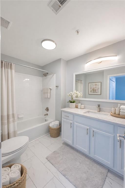 3040 Peachtree Road Northwest, Unit 613 Atlanta, GA 30305 - Photo 12 of 30 a bathroom with a bathtub shower sink mirror and toilet