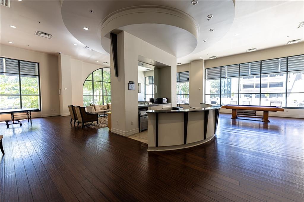 3040 Peachtree Road Northwest, Unit 613 Atlanta, GA 30305 - Photo 25 of 30 a living room with furniture and floor to ceiling windows