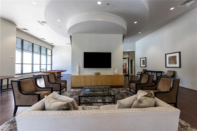 a view of a swimming pool with seating space