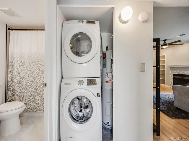 a view of a hallway with washer and dryer