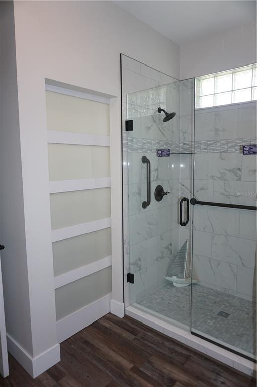 6722 Southwest 111th Loop Ocala, FL 34476 - Photo 30 of 51 FROSTED POCKET DOOR TO PRIVATE COMMODE
