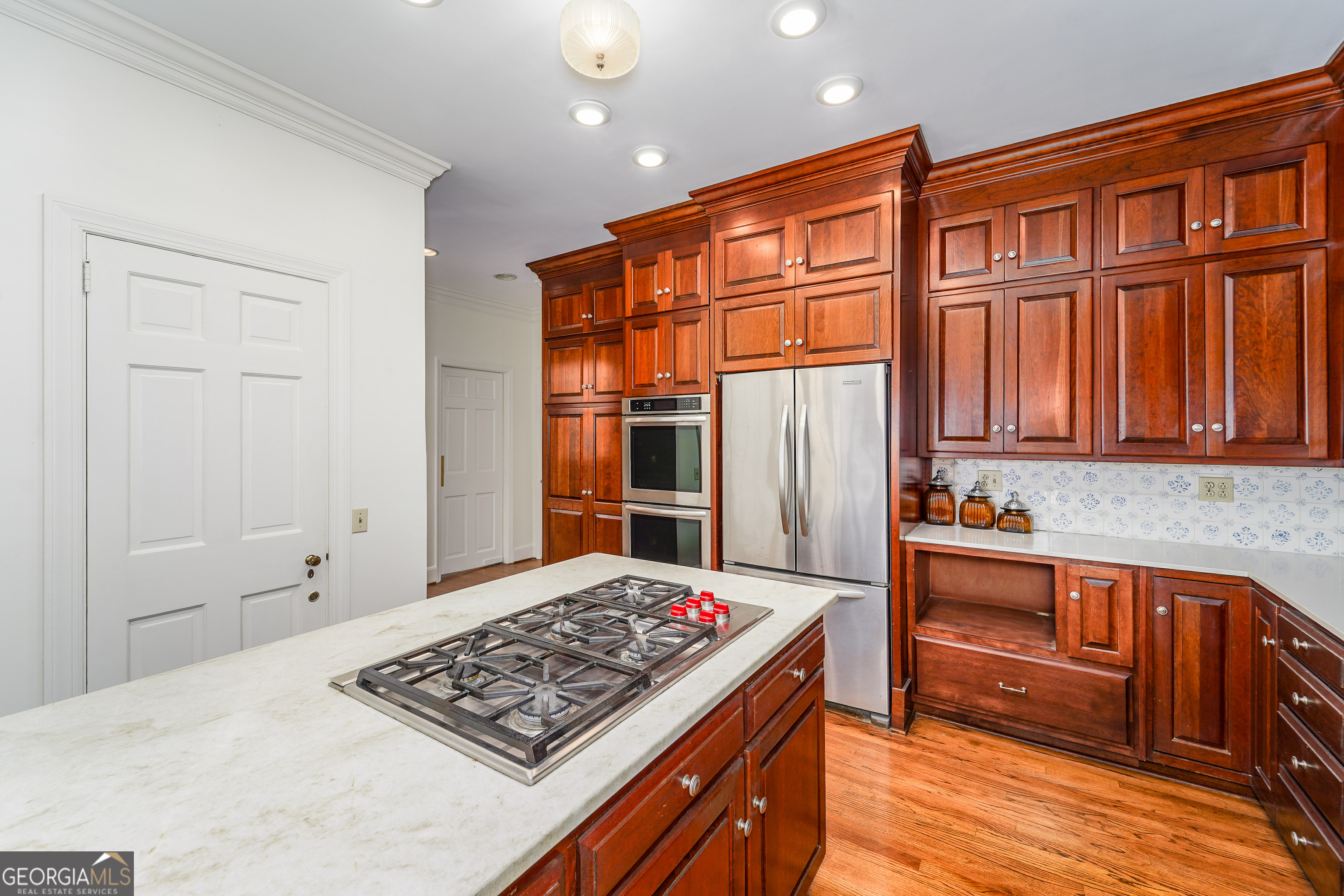 1602 Ward St Extension West Douglas, GA 31533 - Photo 28 of 70 a kitchen with stainless steel appliances granite countertop a stove a sink and a refrigerator