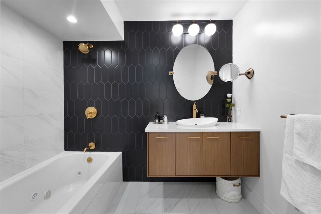 112 West 9th Street, Unit PH4 Boston, MA 02127 - Photo 22 of 34 a bathroom with a sink and a mirror