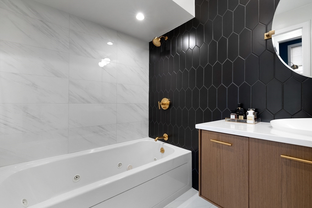 112 West 9th Street, Unit PH4 Boston, MA 02127 - Photo 23 of 34 a bathroom with a sink a toilet and shower