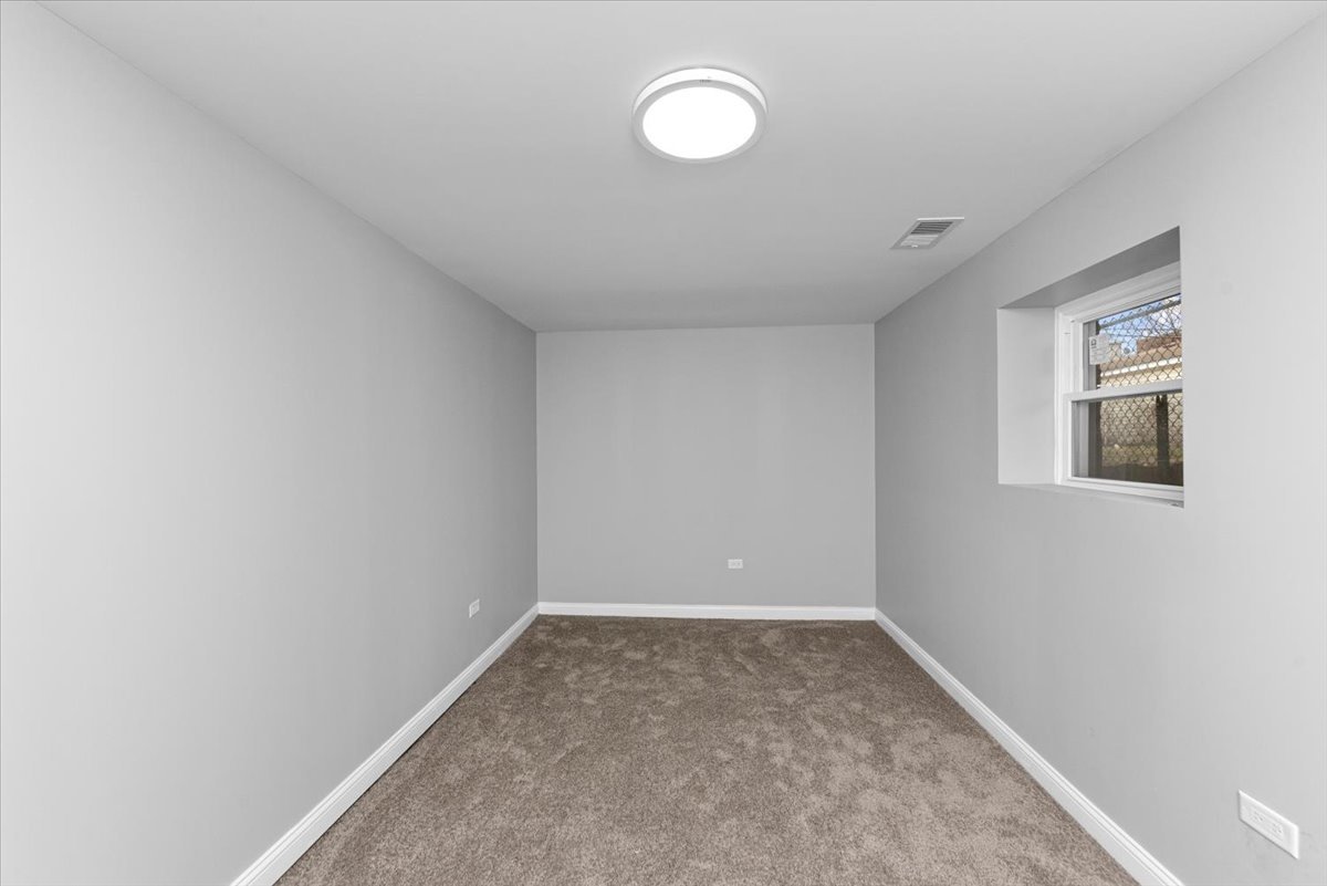 7819 South Morgan Street, Unit G Chicago, IL 60620 - Photo 5 of 13 a view of a room with window and bathroom