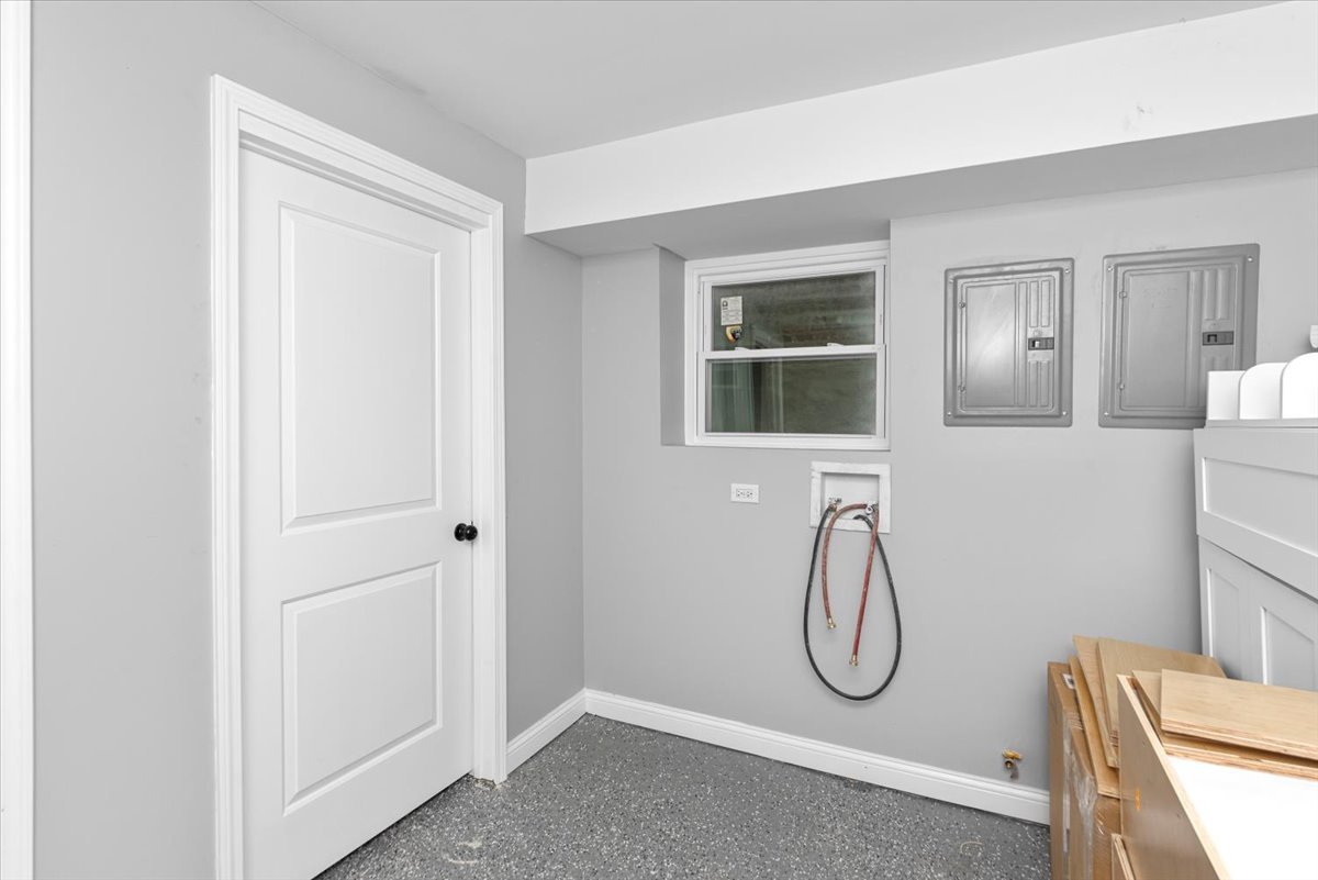 7819 South Morgan Street, Unit G Chicago, IL 60620 - Photo 10 of 13 a bathroom with a granite countertop shower a mirror and a shower