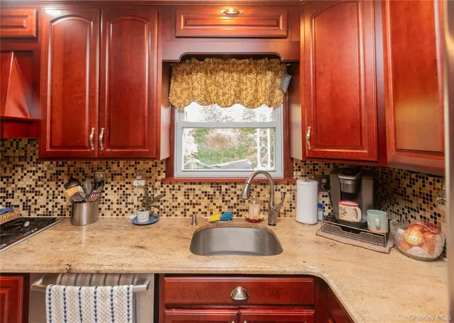 a bathroom with a sink and a window