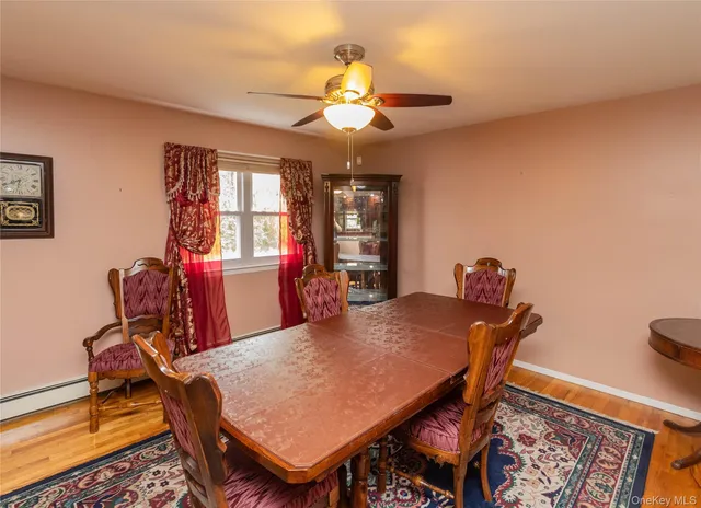 a dining room with furniture and chandelier