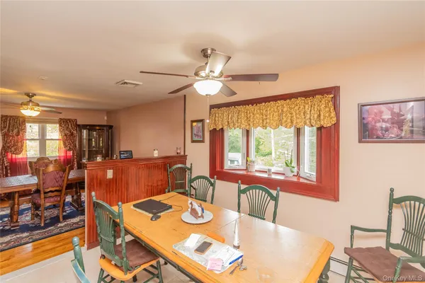 a living room with stainless steel appliances kitchen island granite countertop furniture and a kitchen view
