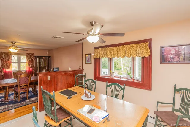 a living room with stainless steel appliances kitchen island granite countertop furniture and a kitchen view