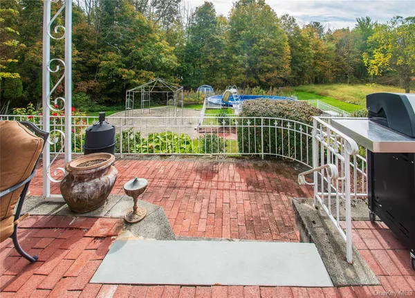 a view of a chairs and tables in the balcony
