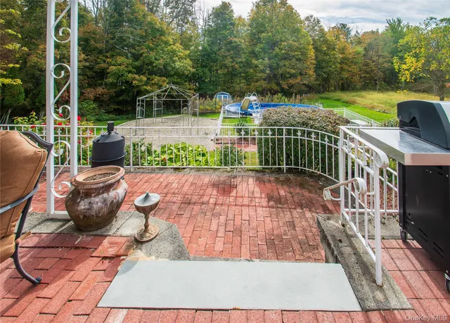 a view of a chairs and tables in the balcony