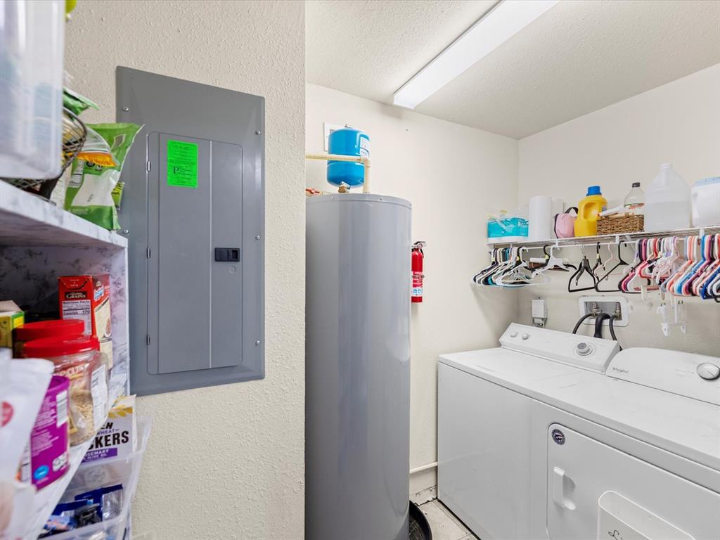 7114 Carlow Street New Port Richey, FL 34653 - Photo 15 of 65 a utility room with dryer and washer